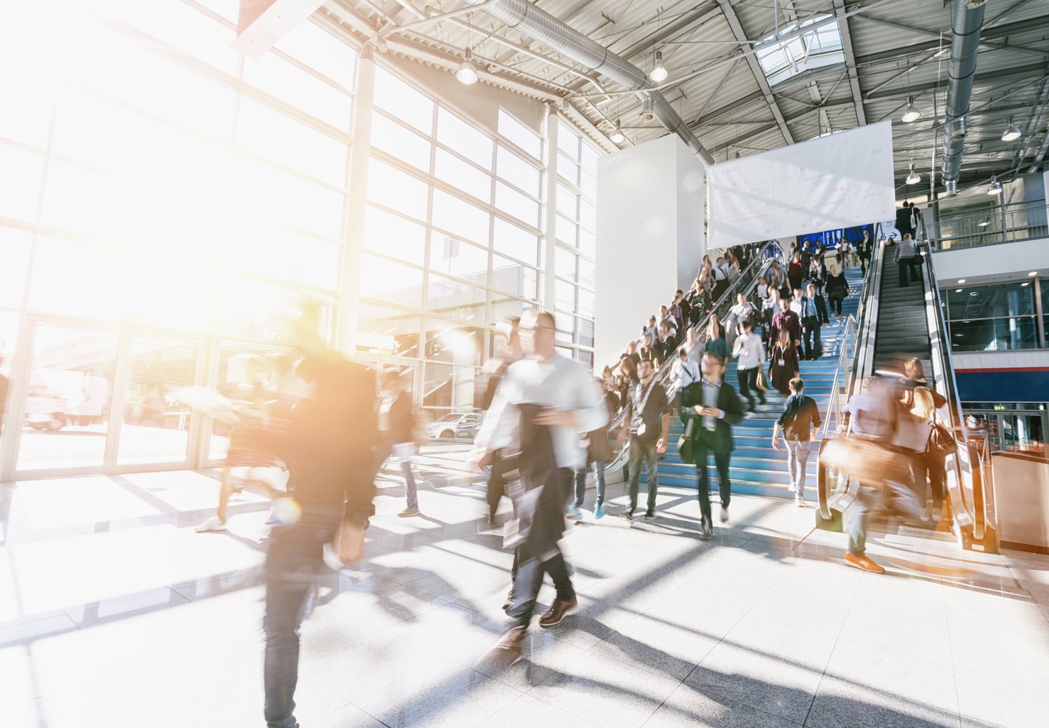 Crowd of Blurred Business People at a Trade Show, with Copy Spac